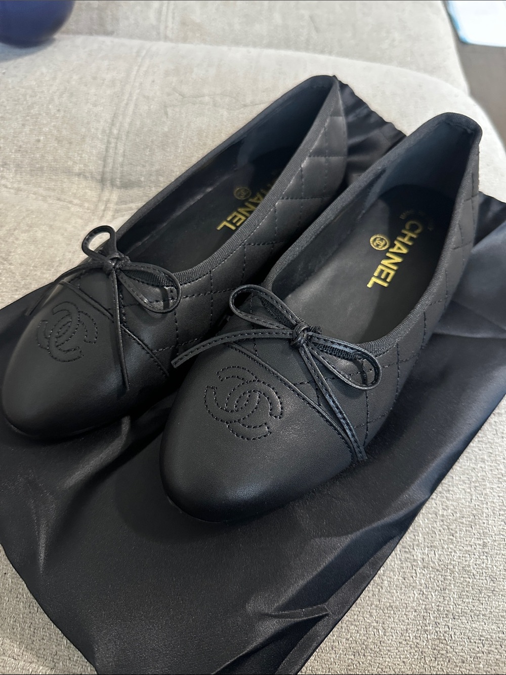 CHANEL Black Quilted CC Logo Bow Ballet Flats